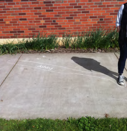Documenting changes in a group member's shadow on a sunny day near the beginning and end of class.