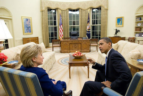 President Obama talks with Hillary Clinton in Oval Office